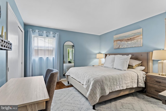 3 Round Hill Rd, Camp Hill, PA 17011 - bedroom with arched walkways, a closet, and wood finished floors