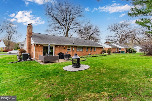 3 Round Hill Rd, Camp Hill, PA 17011 - rear view of house featuring a patio, central air condition unit, a chimney, a fire pit, and brick siding