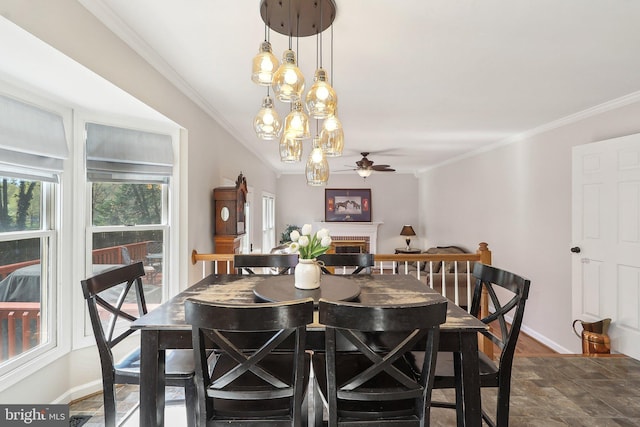 8519 Century Oak Ct, Fairfax Station, VA 22039 - dining area with ornamental molding, ceiling fan, and a fireplace