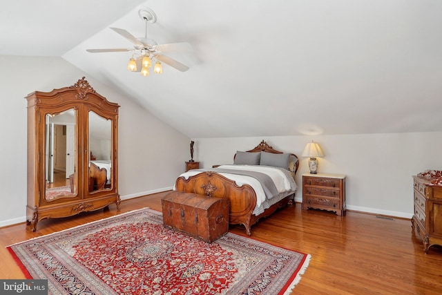 8519 Century Oak Ct, Fairfax Station, VA 22039 - bedroom with baseboards, a ceiling fan, wood finished floors, and lofted ceiling