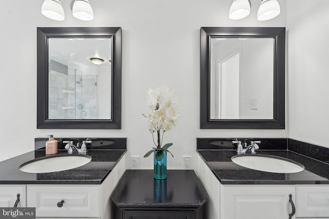 8519 Century Oak Ct, Fairfax Station, VA 22039 - bathroom featuring a shower with shower door, two vanities, and a sink