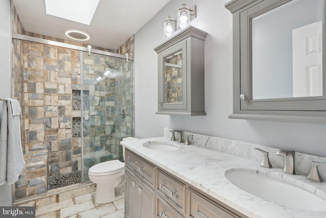 8519 Century Oak Ct, Fairfax Station, VA 22039 - bathroom with a shower stall, a skylight, double vanity, and a sink