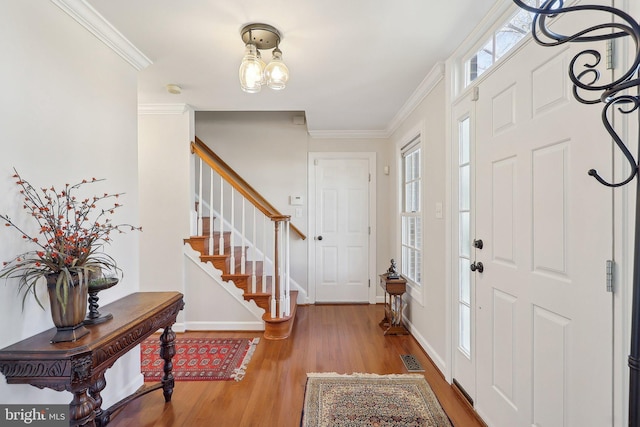 8519 Century Oak Ct, Fairfax Station, VA 22039 - entryway featuring plenty of natural light, visible vents, ornamental molding, and wood finished floors
