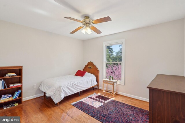 8519 Century Oak Ct, Fairfax Station, VA 22039 - bedroom with baseboards, a ceiling fan, and wood finished floors