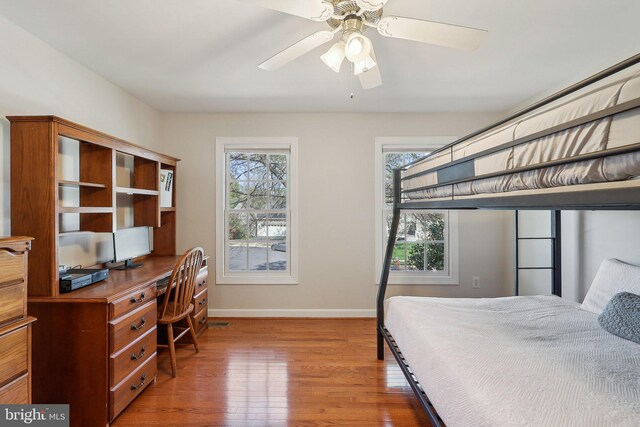 8519 Century Oak Ct, Fairfax Station, VA 22039 - bedroom with ceiling fan, multiple windows, baseboards, and wood finished floors