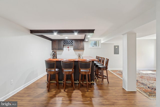 8519 Century Oak Ct, Fairfax Station, VA 22039 - bar with indoor wet bar, dark wood-style flooring, baseboards, and beam ceiling