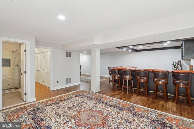 8519 Century Oak Ct, Fairfax Station, VA 22039 - bar featuring visible vents, a dry bar, and wood finished floors