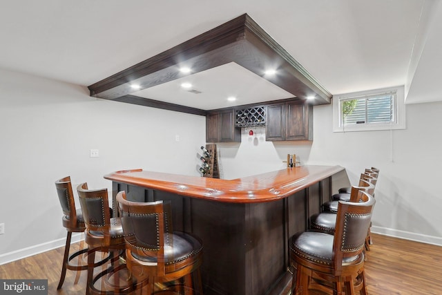 8519 Century Oak Ct, Fairfax Station, VA 22039 - bar featuring wood finished floors, bar area, and baseboards