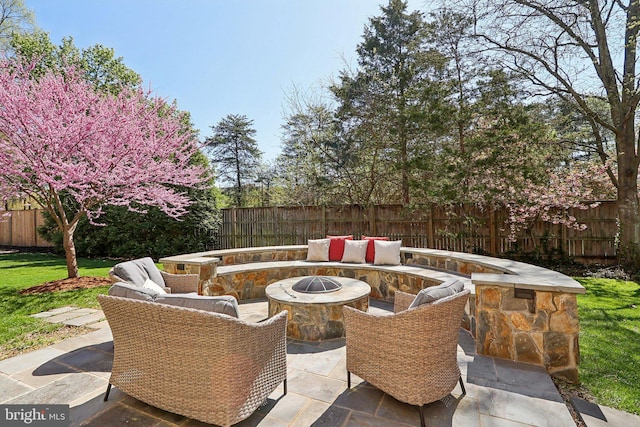 8519 Century Oak Ct, Fairfax Station, VA 22039 - view of patio featuring a fenced backyard and an outdoor fire pit