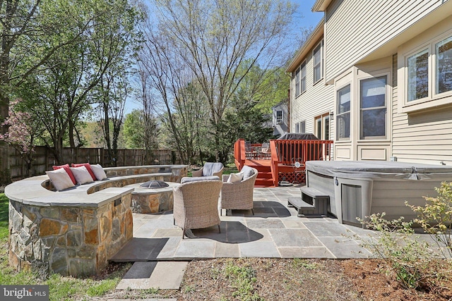 8519 Century Oak Ct, Fairfax Station, VA 22039 - view of patio featuring a fire pit, a deck, fence, and a hot tub