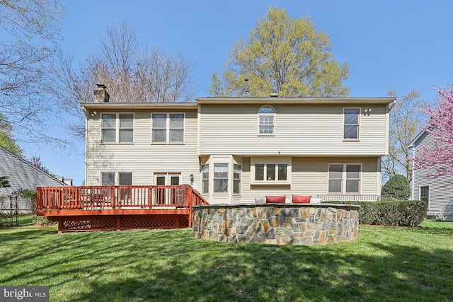 8519 Century Oak Ct, Fairfax Station, VA 22039 - back of house featuring a wooden deck, a lawn, and a chimney