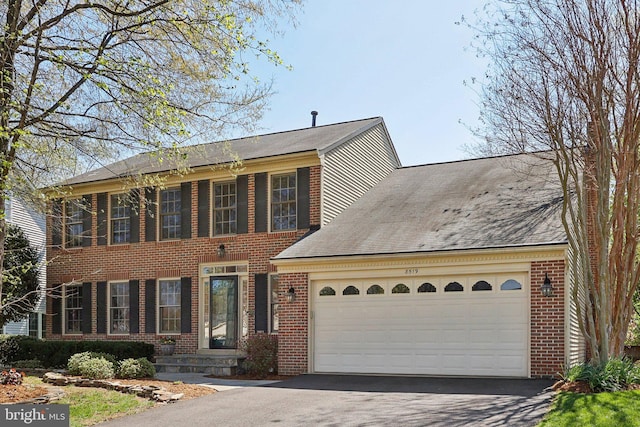 8519 Century Oak Ct, Fairfax Station, VA 22039 - view of front of property featuring brick siding, roof with shingles, a garage, and aphalt driveway