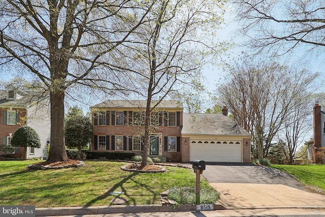 8519 Century Oak Ct, Fairfax Station, VA 22039 - colonial inspired home featuring brick siding, an attached garage, driveway, and a front lawn