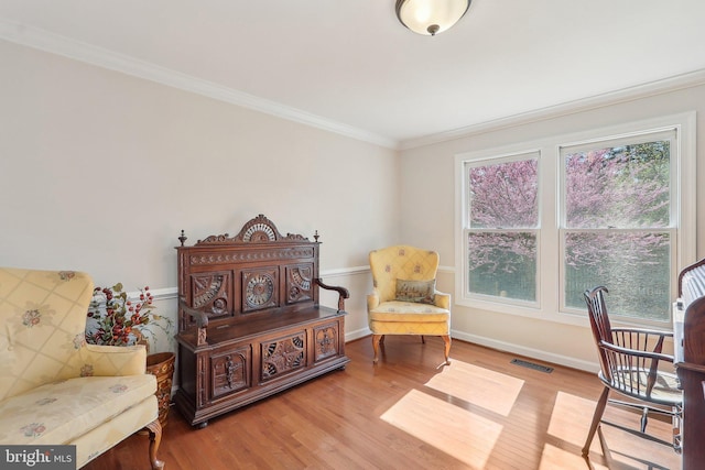 8519 Century Oak Ct, Fairfax Station, VA 22039 - living area with visible vents, baseboards, crown molding, and wood finished floors