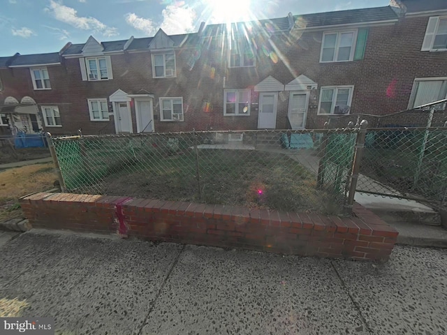 44 Branford Rd, Darby, PA 19023 - view of property featuring brick siding and a fenced front yard