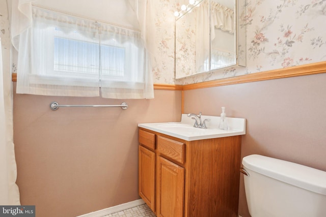 half bath with toilet and vanity