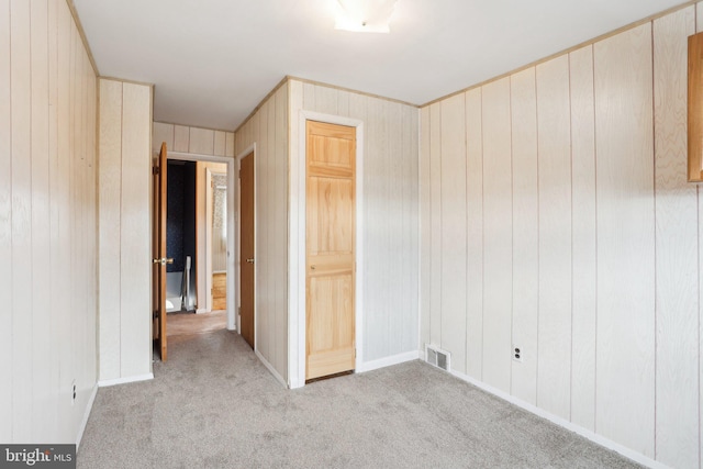 unfurnished bedroom with carpet and visible vents