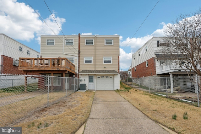 rear view of house featuring fence, driveway, cooling unit, and a garage