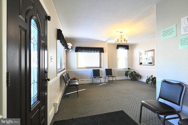 109 N Centre St, Philipsburg, PA 16866 - living area featuring a notable chandelier, carpet, baseboards, and a baseboard heating unit
