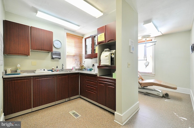 109 N Centre St, Philipsburg, PA 16866 - kitchen with light countertops, a sink, a wealth of natural light, and visible vents