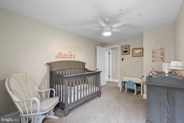 carpeted bedroom featuring baseboards and ceiling fan