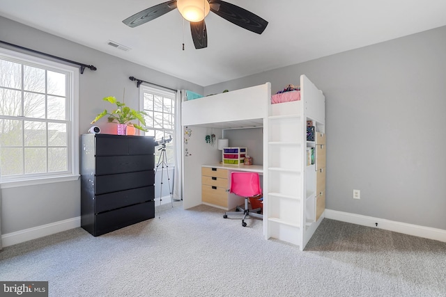 carpeted bedroom with visible vents, baseboards, and ceiling fan