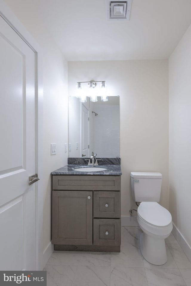 21 Piute Trl, Albrightsville, PA 18210 - bathroom with baseboards, vanity, marble look tile flooring, and toilet
