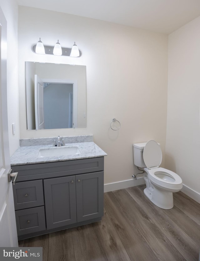 21 Piute Trl, Albrightsville, PA 18210 - bathroom featuring wood finished floors, toilet, vanity, and baseboards