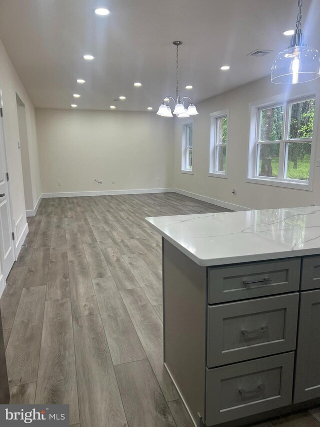 21 Piute Trl, Albrightsville, PA 18210 - kitchen featuring gray cabinets, recessed lighting, a chandelier, light countertops, and light wood-type flooring