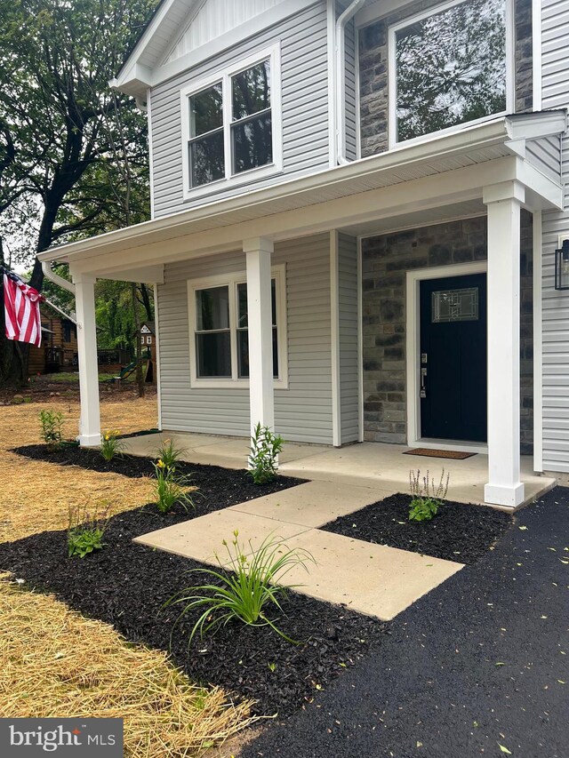 21 Piute Trl, Albrightsville, PA 18210 - view of exterior entry featuring covered porch and stone siding