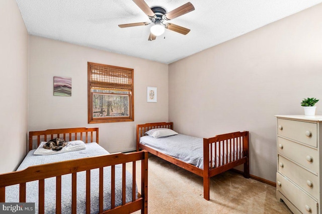 bedroom featuring light carpet and a ceiling fan