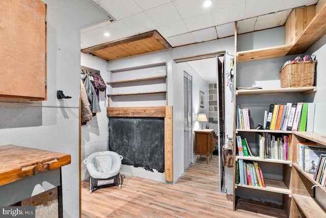 interior space featuring wood finished floors and recessed lighting