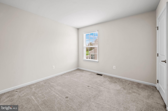 unfurnished bedroom with visible vents, baseboards, and carpet floors
