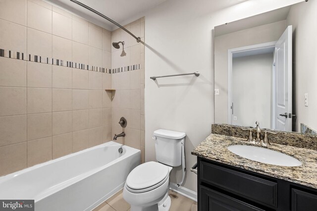 full bath featuring toilet, vanity, baseboards, and tub / shower combination