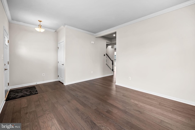 interior space featuring stairs, dark wood-style flooring, baseboards, and crown molding