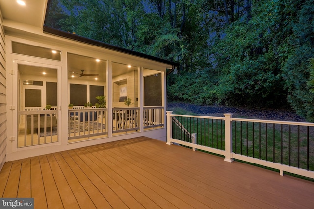 deck at twilight with a sunroom