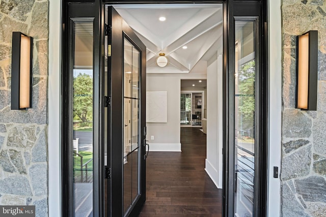 foyer with dark wood finished floors, baseboards, beamed ceiling, and recessed lighting