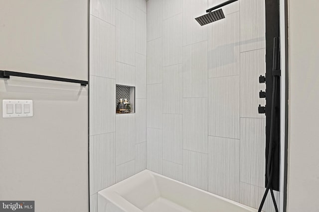 bathroom with a tile shower