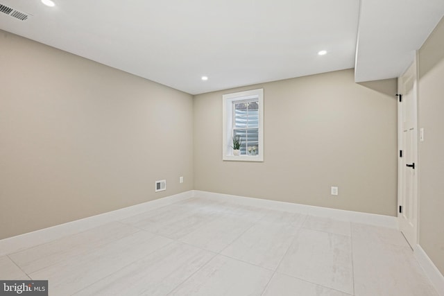 unfurnished room featuring baseboards, visible vents, recessed lighting, and light tile patterned flooring