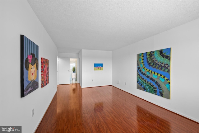200 N Pickett St N Unit 1513, Alexandria, VA 22304 - interior space featuring baseboards, wood finished floors, and a textured ceiling