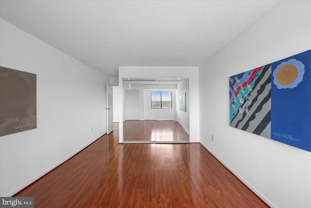 200 N Pickett St N Unit 1513, Alexandria, VA 22304 - interior space featuring baseboards, wood finished floors, and a textured ceiling