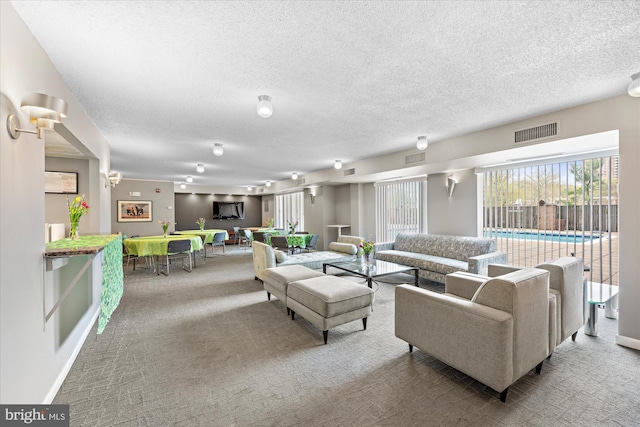 200 N Pickett St N Unit 1513, Alexandria, VA 22304 - living area with carpet, visible vents, and a textured ceiling