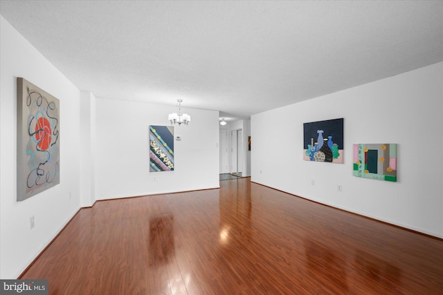 200 N Pickett St N Unit 1513, Alexandria, VA 22304 - unfurnished living room featuring baseboards, a notable chandelier, and wood finished floors