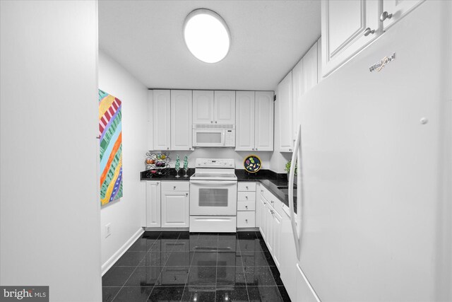 200 N Pickett St N Unit 1513, Alexandria, VA 22304 - kitchen featuring white cabinetry, dark countertops, granite finish floor, and white appliances