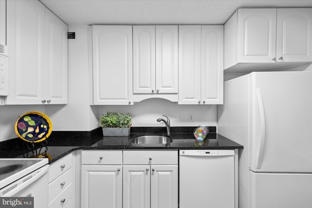 200 N Pickett St N Unit 1513, Alexandria, VA 22304 - kitchen featuring white cabinets, dark stone countertops, a sink, and white appliances