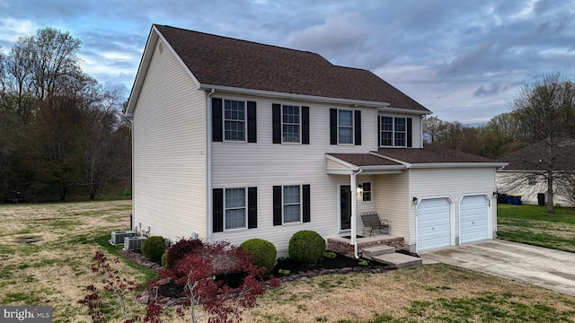 174 W Chestnut Ridge Dr, Magnolia, DE 19962 - view of front of home with driveway, a front yard, a garage, and roof with shingles