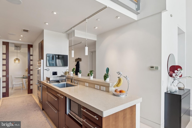 1612 16th St NW Unit 3, Washington, DC 20009 - kitchen with a sink, recessed lighting, light countertops, hanging light fixtures, and stainless steel oven
