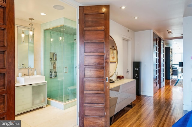1612 16th St NW Unit 3, Washington, DC 20009 - hallway featuring a sink, wood finished floors, and recessed lighting