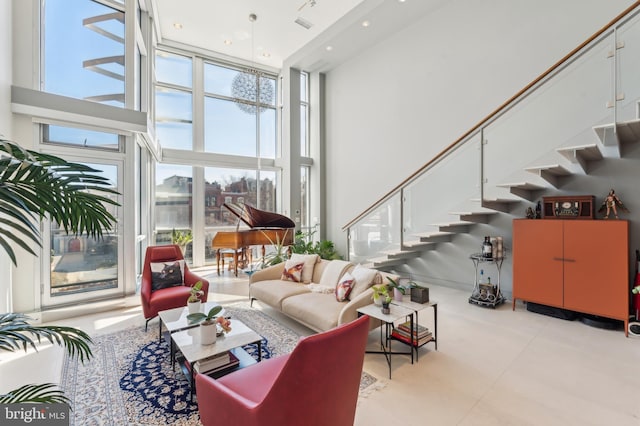 1612 16th St NW Unit 3, Washington, DC 20009 - living room featuring a high ceiling, stairs, recessed lighting, and expansive windows