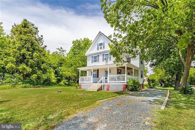 24171 Adelaide St, Parksley, VA 23421 - view of front of home with covered porch, driveway, and a front lawn